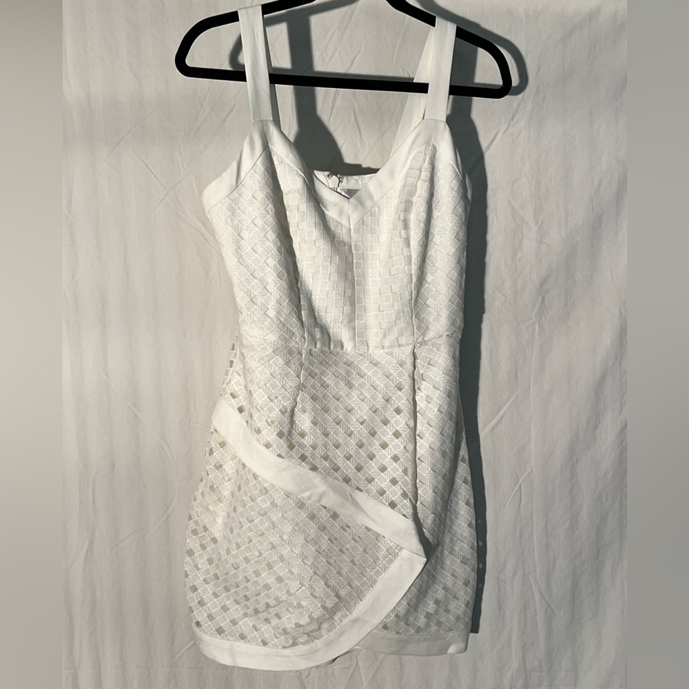 Adelyn Rae Size M white mini dress with lattice overlay. NWOT
